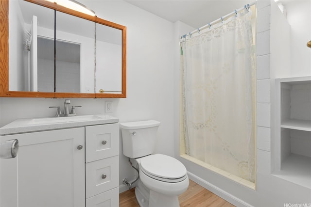 636 Nalanui St Unit 302, Honolulu, HI 96817 - bathroom featuring wood finished floors, toilet, vanity, and shower / bath combination with curtain