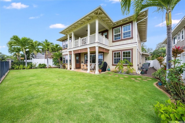 91-1099 Waikai St, Ewa Beach, HI 96706 - rear view of house featuring a balcony, a patio area, central AC unit, and stucco siding