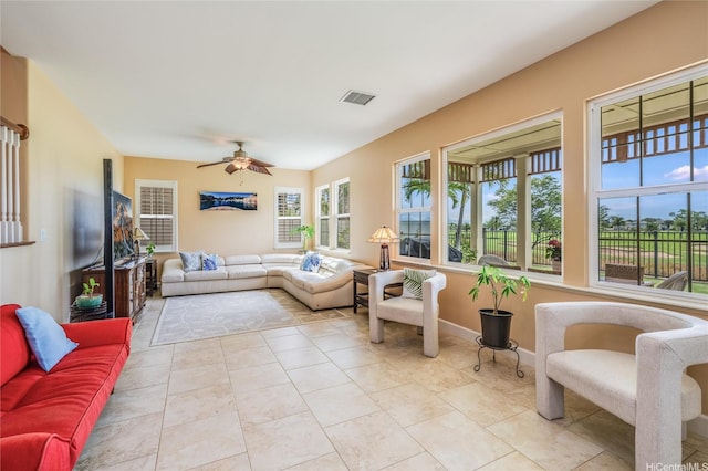 91-1099 Waikai St, Ewa Beach, HI 96706 - living room featuring a ceiling fan, light tile patterned floors, and baseboards