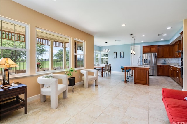 91-1099 Waikai St, Ewa Beach, HI 96706 - living room featuring baseboards and recessed lighting