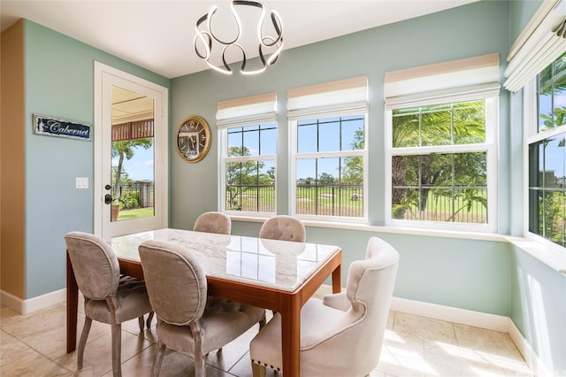 91-1099 Waikai St, Ewa Beach, HI 96706 - dining space featuring baseboards, healthy amount of natural light, a chandelier, and light tile patterned flooring
