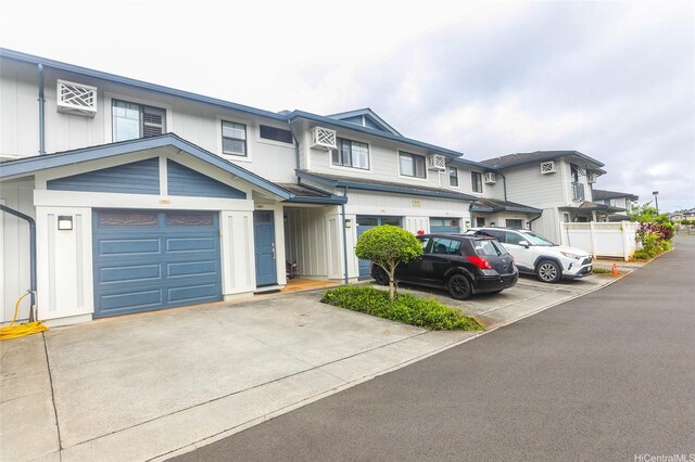 95-955 Ukuwai St Unit 1703, Mililani, HI 96789 - view of property featuring board and batten siding and driveway