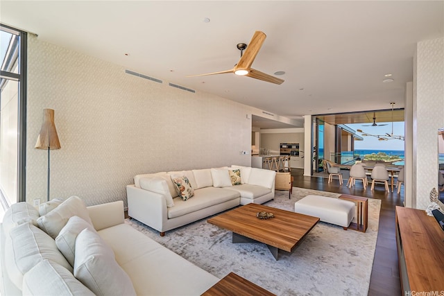 1388 Ala Moana Blvd Unit 8805, Honolulu, HI 96814 - living room featuring a ceiling fan, wallpapered walls, and wood finished floors