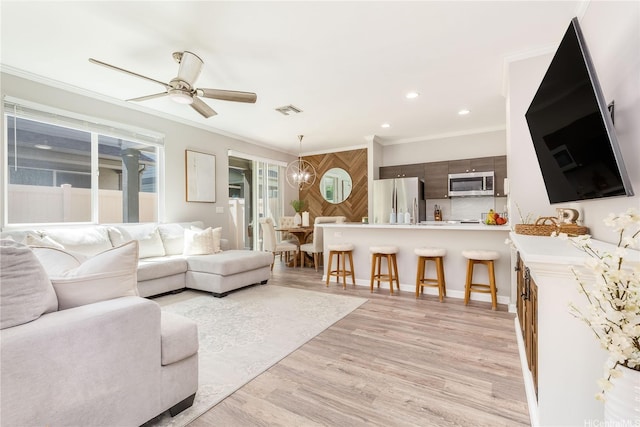 91-1160 Kamakana St Unit 609, Ewa Beach, HI 96706 - living area featuring ornamental molding, a ceiling fan, light wood finished floors, and recessed lighting