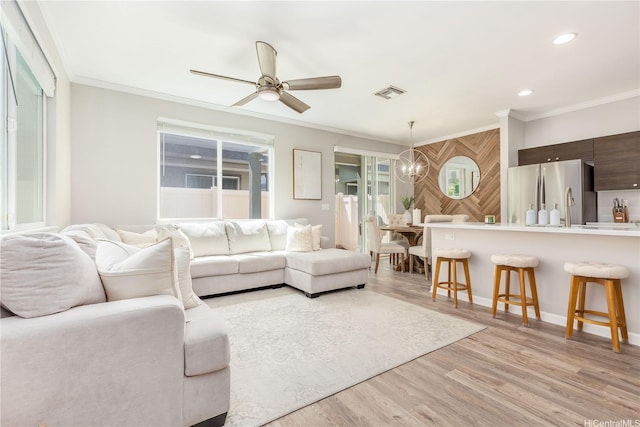 91-1160 Kamakana St Unit 609, Ewa Beach, HI 96706 - living room featuring ornamental molding, a ceiling fan, light wood-type flooring, a chandelier, and recessed lighting