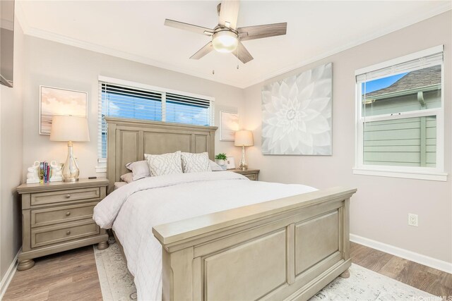91-1160 Kamakana St Unit 609, Ewa Beach, HI 96706 - bedroom with baseboards, light wood-style flooring, ornamental molding, and ceiling fan