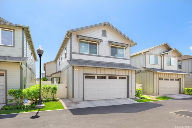 91-1160 Kamakana St Unit 609, Ewa Beach, HI 96706 - townhome / multi-family property featuring board and batten siding, a garage, and roof with shingles