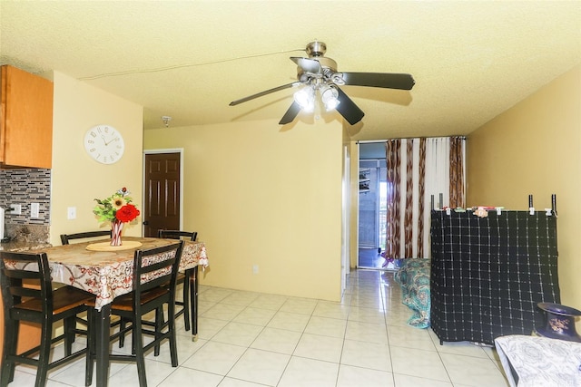 1260 Richard Ln Unit B601, Honolulu, HI 96819 - dining area with a ceiling fan, light tile patterned flooring, and a textured ceiling