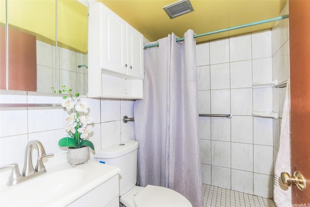 1260 Richard Ln Unit B601, Honolulu, HI 96819 - bathroom with tile walls, toilet, a tile shower, vanity, and decorative backsplash