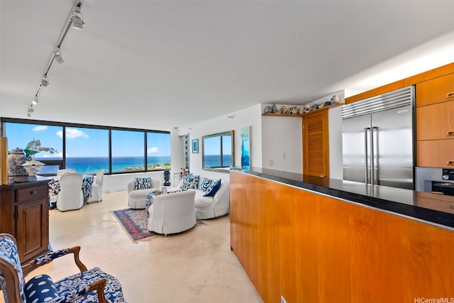 1330 Ala Moana Blvd Unit 3202, Honolulu, HI 96814 - living room featuring rail lighting and a water view