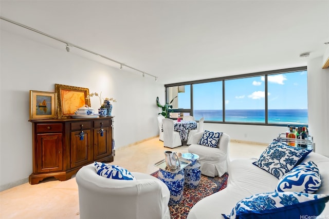 1330 Ala Moana Blvd Unit 3202, Honolulu, HI 96814 - living room with rail lighting, carpet floors, and a water view
