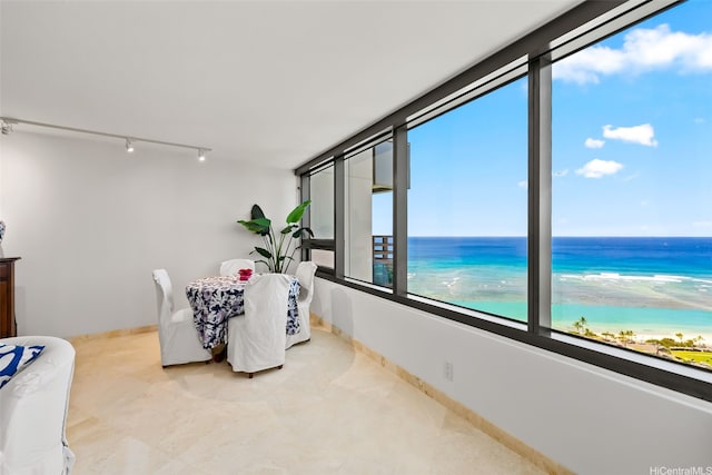 1330 Ala Moana Blvd Unit 3202, Honolulu, HI 96814 - dining area featuring rail lighting, a water view, and baseboards