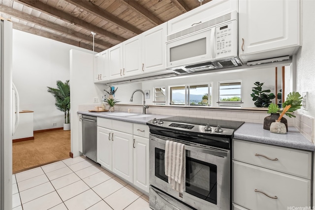 44-140-5MUIPL Mui Pl Unit 2705, Kaneohe, HI 96744 - kitchen featuring appliances with stainless steel finishes, wooden ceiling with exposed beams, a sink, light countertops, and white cabinetry