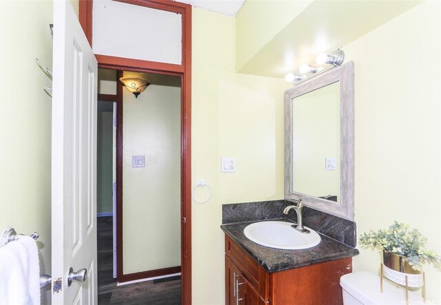94-249 Waikele Rd Unit B209, Waipahu, HI 96797 - half bathroom with vanity, toilet, and wood finished floors