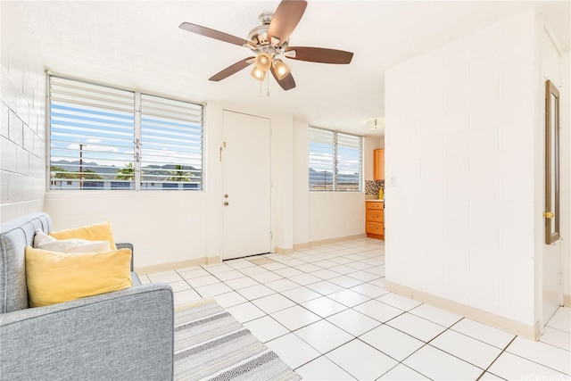 1519 Kaumualii St Unit 316, Honolulu, HI 96817 - foyer entrance with a ceiling fan, light tile patterned floors, and healthy amount of natural light