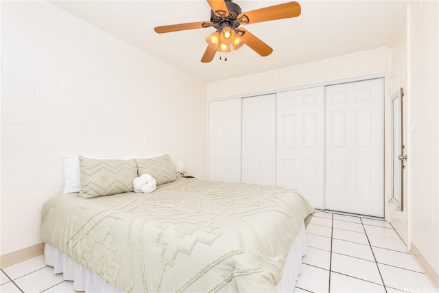 1519 Kaumualii St Unit 316, Honolulu, HI 96817 - bedroom featuring light tile patterned floors, a closet, and a ceiling fan