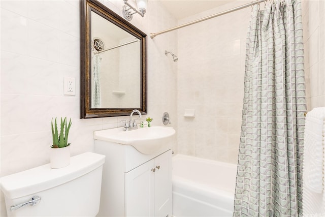 1519 Kaumualii St Unit 316, Honolulu, HI 96817 - bathroom with tile walls, shower / bath combo with shower curtain, vanity, toilet, and tasteful backsplash