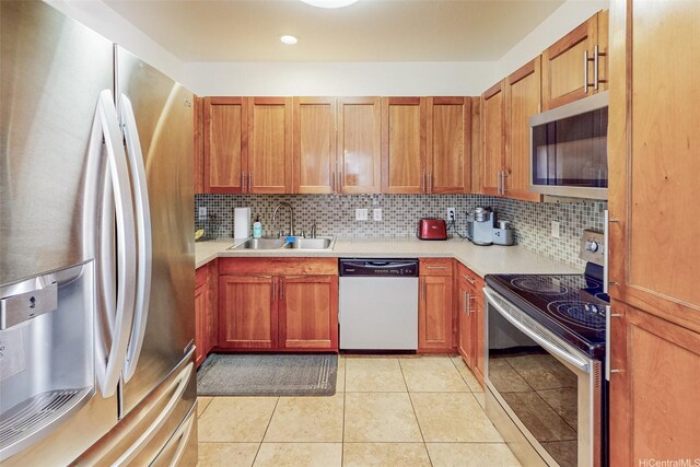 91-215 Keonekapu Pl, Ewa Beach, HI 96706 - kitchen featuring appliances with stainless steel finishes, a sink, light countertops, and tasteful backsplash