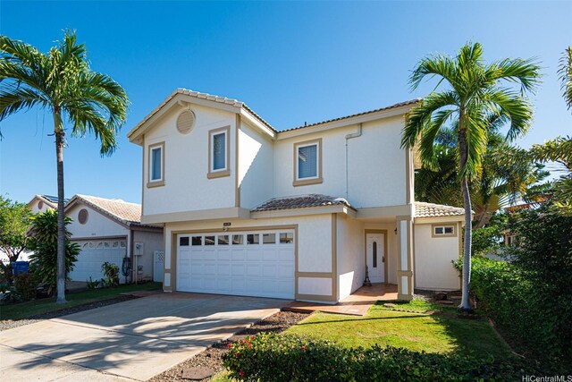 91-215 Keonekapu Pl, Ewa Beach, HI 96706 - view of front facade with an attached garage, a tiled roof, driveway, and stucco siding