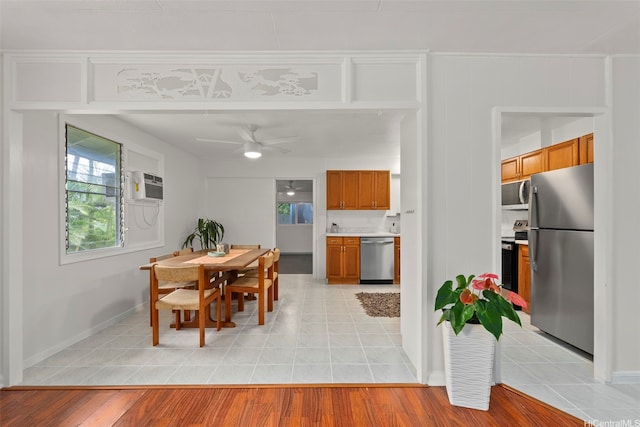 41-179 Nalu St, Waimanalo, HI 96795 - dining room featuring ceiling fan, baseboards, a wall mounted AC, and light tile patterned floors