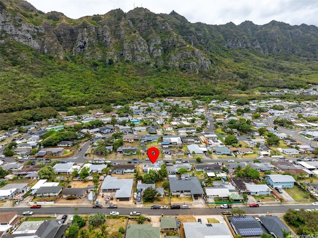 41-179 Nalu St, Waimanalo, HI 96795 - aerial view of property's location with a mountain backdrop, nearby suburban area, and a heavily wooded area