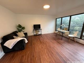 87-130 Helelua St Unit E102, Waianae, HI 96792 - living area with wood finished floors and baseboards