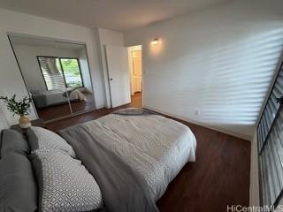 87-130 Helelua St Unit E102, Waianae, HI 96792 - bedroom featuring wood finished floors