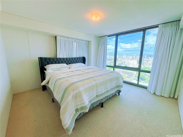 1200 Queen Emma St Unit 2804, Honolulu, HI 96813 - bedroom with a wall of windows, light colored carpet, and a city view