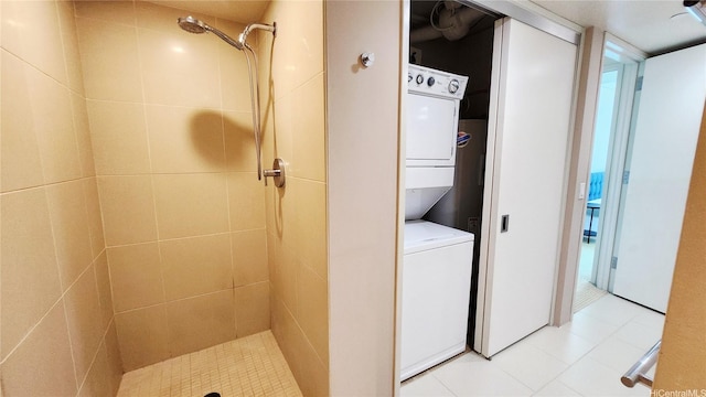 1200 Queen Emma St Unit 2804, Honolulu, HI 96813 - bathroom featuring stacked washer / dryer, a tile shower, and tile patterned flooring