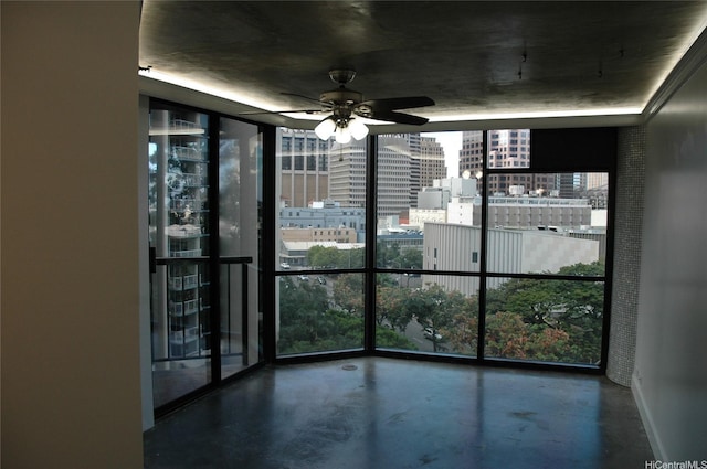 60 N Beretania St Unit 909, Honolulu, HI 96817 - unfurnished room with a wall of windows, finished concrete flooring, plenty of natural light, ceiling fan, and a view of city
