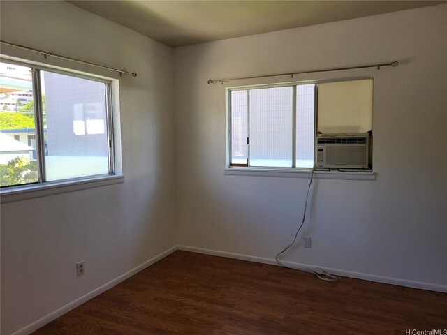 2317 Lime St Unit 2317, Honolulu, HI 96826 - empty room with cooling unit, wood finished floors, and baseboards