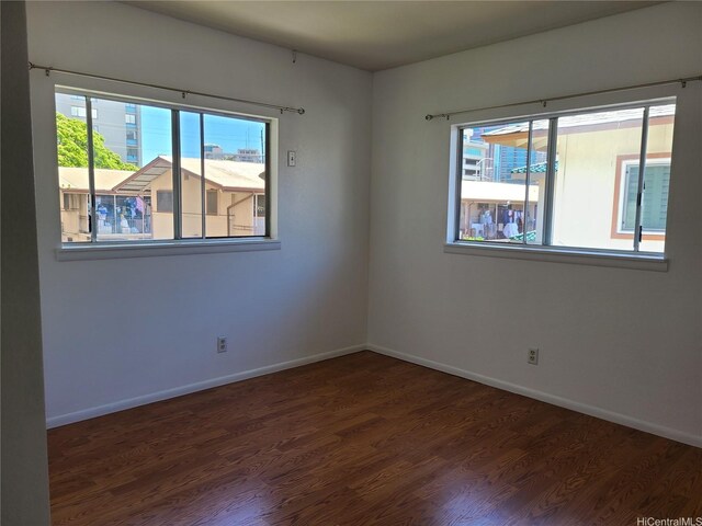 2317 Lime St Unit 2317, Honolulu, HI 96826 - spare room featuring healthy amount of natural light, wood finished floors, and baseboards
