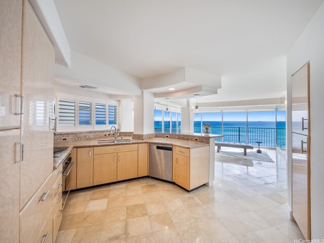 3015 Kalakaua Ave Unit 901, Honolulu, HI 96815 - kitchen with dishwasher, a sink, light brown cabinets, a water view, and a peninsula
