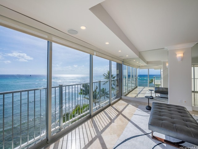 3015 Kalakaua Ave Unit 901, Honolulu, HI 96815 - sunroom / solarium with view of water and beach, recessed lighting, and floor to ceiling windows