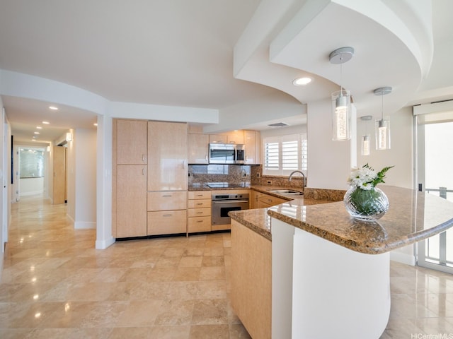 3015 Kalakaua Ave Unit 901, Honolulu, HI 96815 - kitchen featuring appliances with stainless steel finishes, light brown cabinetry, a peninsula, a sink, and recessed lighting