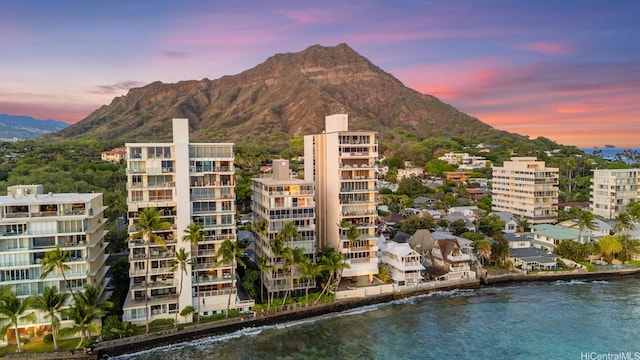 3015 Kalakaua Ave Unit 901, Honolulu, HI 96815 - property at dusk with a water and mountain view
