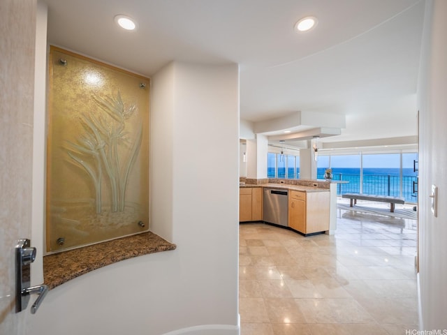 3015 Kalakaua Ave Unit 901, Honolulu, HI 96815 - kitchen featuring dishwasher, a water view, light tile patterned floors, a peninsula, and light brown cabinets