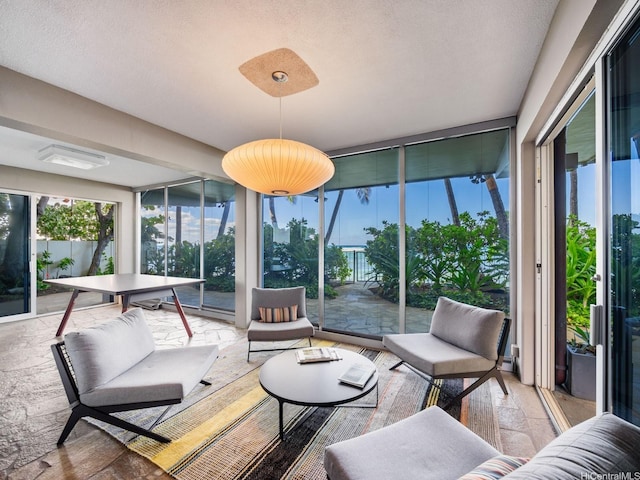 3015 Kalakaua Ave Unit 901, Honolulu, HI 96815 - sunroom featuring outdoor lounge area, healthy amount of natural light, and a wall of windows