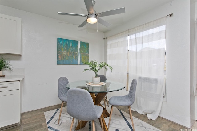 94-1139 Mopua Loop Unit J2, Waipahu, HI 96797 - dining space with light wood finished floors and ceiling fan