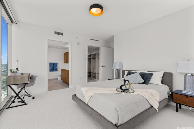629 Keeaumoku St Unit 2912, Honolulu, HI 96814 - bedroom featuring carpet floors, ensuite bath, a walk in closet, and a closet