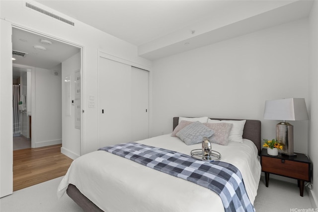 629 Keeaumoku St Unit 2912, Honolulu, HI 96814 - bedroom featuring wood finished floors, a closet, and baseboards