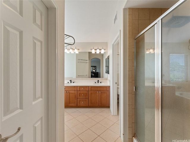91-1105 Kaiko St, Ewa Beach, HI 96706 - full bathroom with tile patterned floors, double vanity, a stall shower, and a bathtub