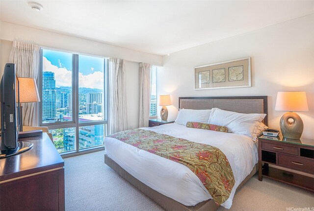 223 Saratoga Rd Unit 2203, Honolulu, HI 96815 - bedroom with carpet flooring, multiple windows, and a city view