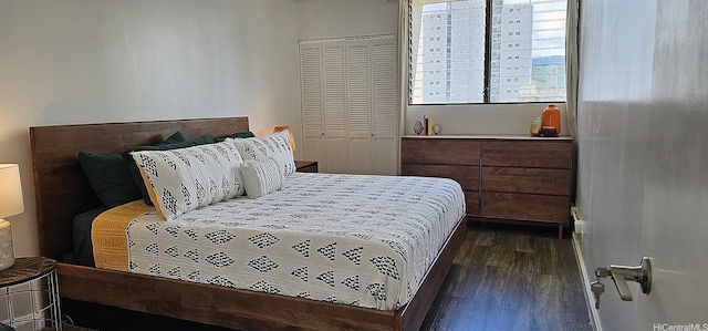 2240 Kuhio Ave Unit 905, Honolulu, HI 96815 - bedroom with dark wood finished floors and a closet