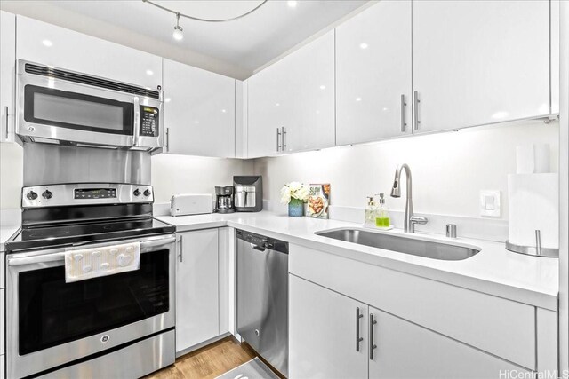 888 Kapiolani Blvd Unit 1512, Honolulu, HI 96813 - kitchen featuring appliances with stainless steel finishes, a sink, and light countertops