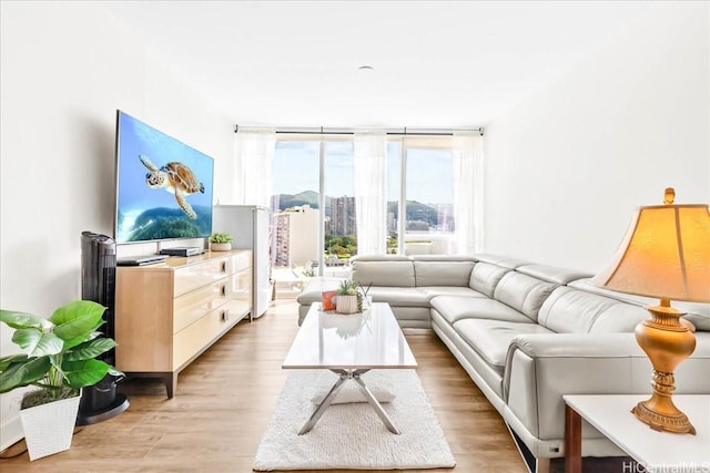 888 Kapiolani Blvd Unit 1512, Honolulu, HI 96813 - living area featuring light wood-type flooring and floor to ceiling windows