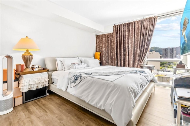 888 Kapiolani Blvd Unit 1512, Honolulu, HI 96813 - bedroom with wood finished floors and a view of city