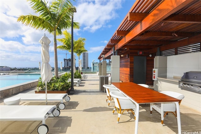 888 Kapiolani Blvd Unit 1512, Honolulu, HI 96813 - view of patio / terrace with grilling area, outdoor dining space, and an outdoor pool