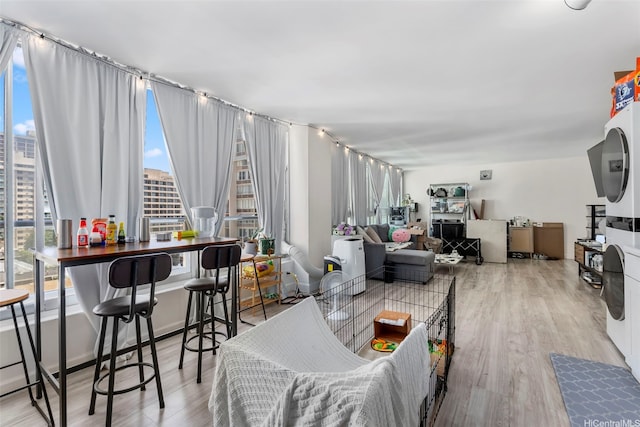 2421 Tusitala St Unit 803, Honolulu, HI 96815 - living area featuring plenty of natural light, wood finished floors, and a city view