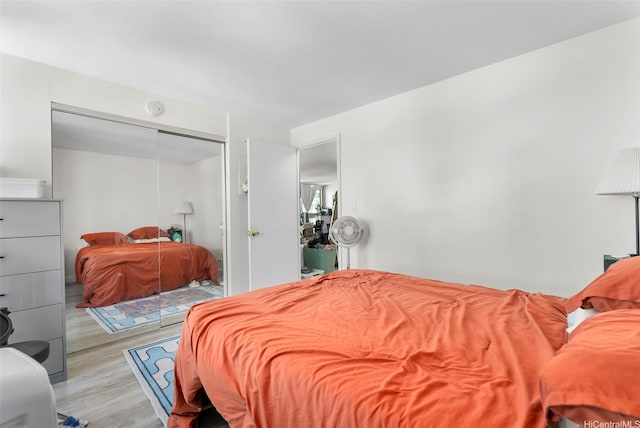 2421 Tusitala St Unit 803, Honolulu, HI 96815 - bedroom with wood finished floors and a closet